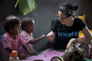 Katy on April 5, surrounded by children age 3 to 6 ~ Photo courtesy of http://weshare.unicef.org