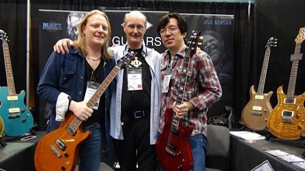 Schofield with "The Mayor" Jeff Guilford of JJ Guitars and Tomo Fujita at the JJ Guitars booth at NAMM '14