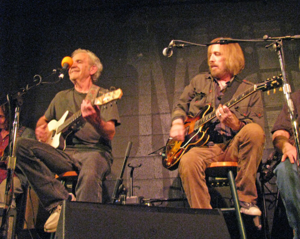 Cale performing alongside Tom Petty