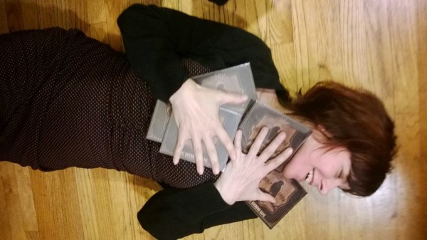 TGG's Kathy Moore embracing her copies of  Holy Crow